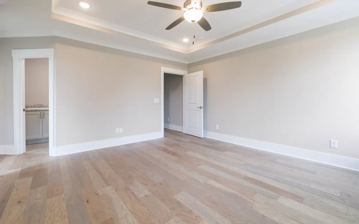 Bright finished room with a ceiling fan and recessed lighting