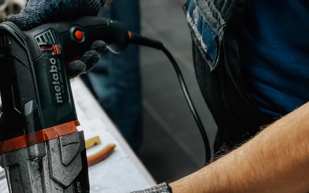 Craftsperson using a drill for a home repair project