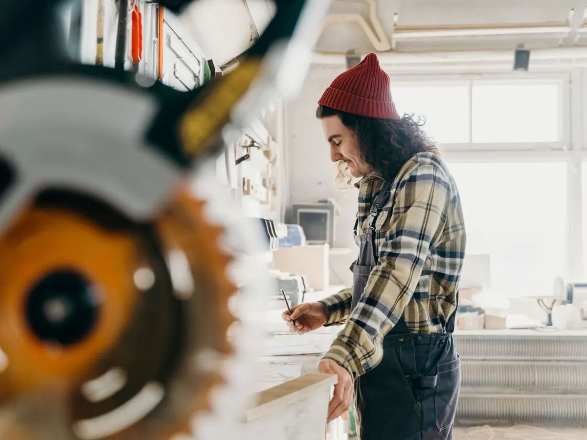 Professional carpenter working in a bright workshop